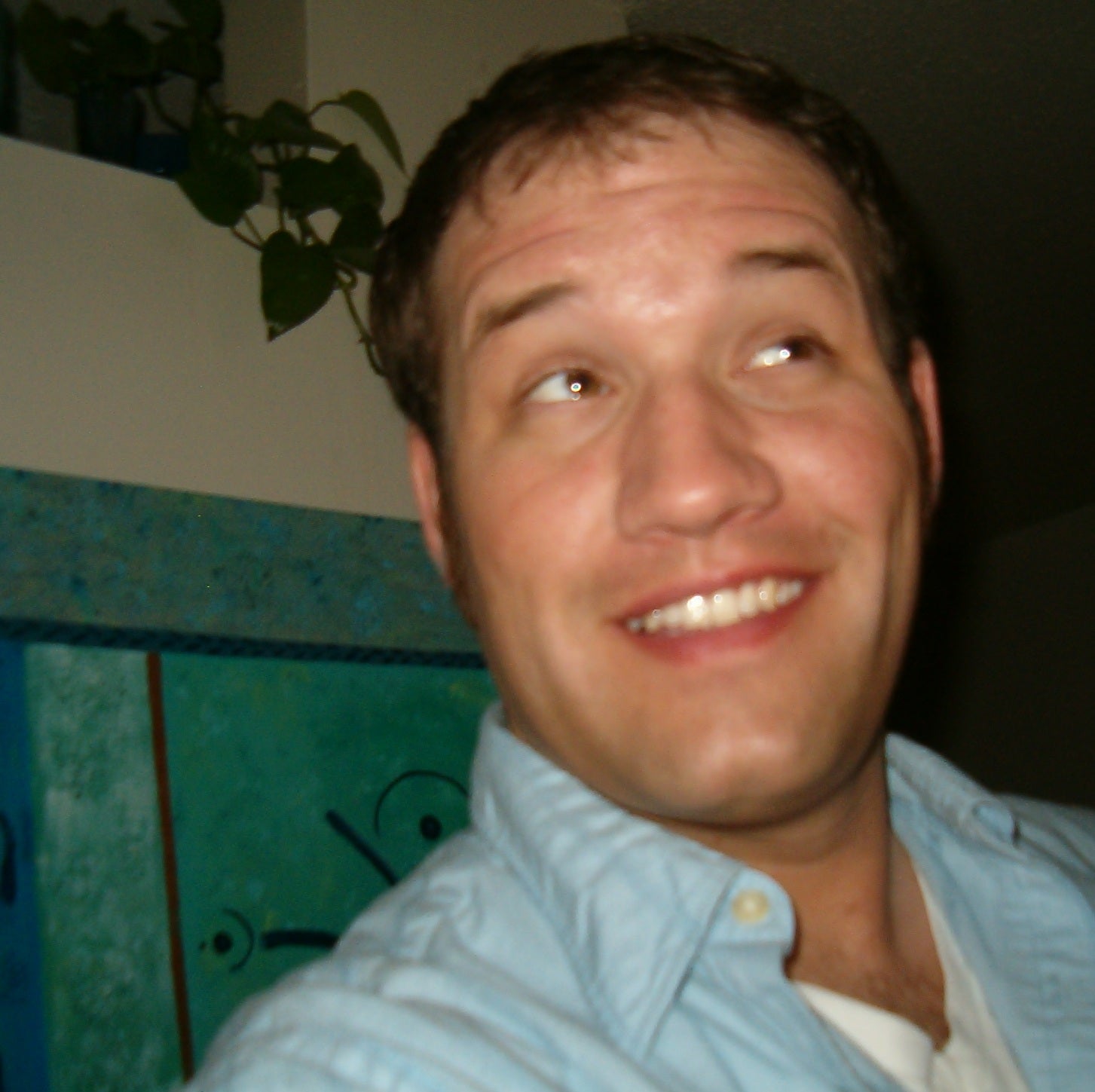 Picture of me in 2010, standing in front of my painting.